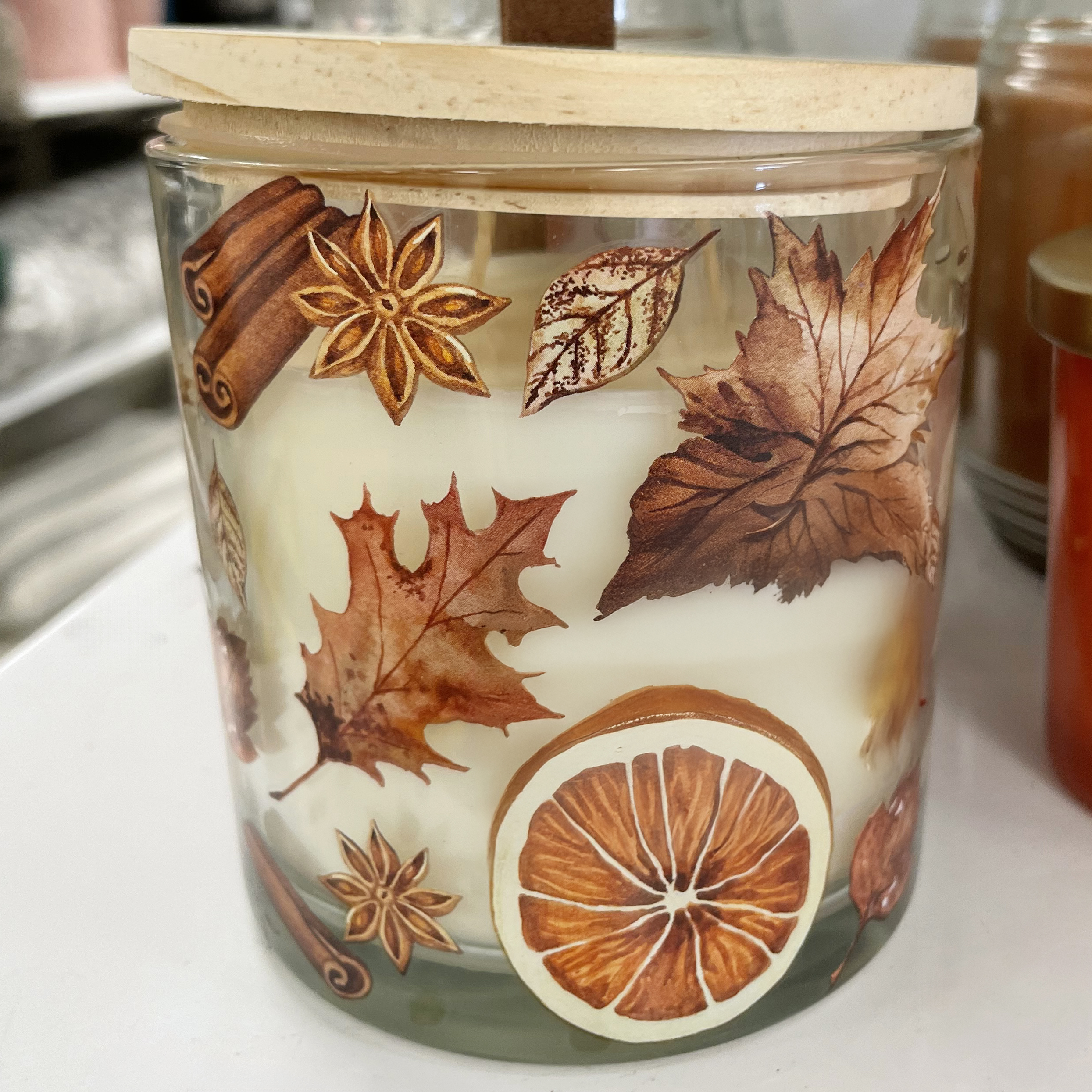 Fall Candle with printed leaves.